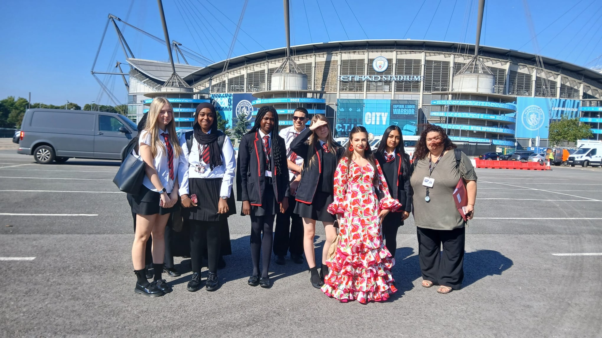 Image of students outside the Etihad Stadium